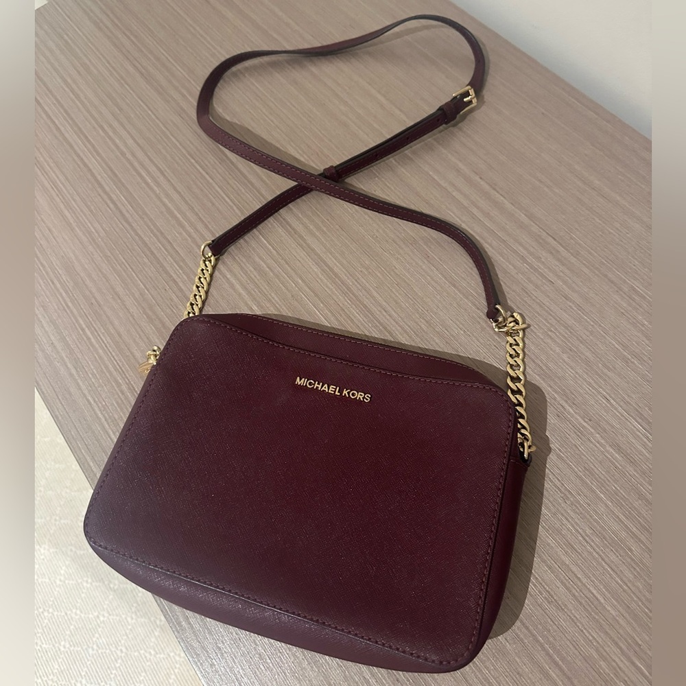 Michael Kors Burgundy and Gold Crossbody Bag with Sleek Design